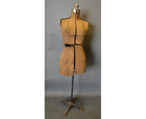 An Early Tailor's Dummy with wrought iron stand, 150cm tall 