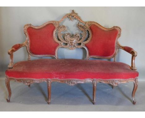 A Late 19th/Early 20th Century French Salon Sofa, the shaped carved pierced and partly upholstered back above a stuff over se