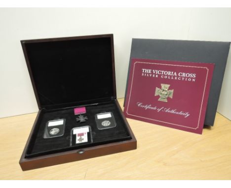 A Limited Edition Set, The Victoria Cross Silver Collection, UK VC Medal Piedfort Silver 50p, UK Heroic Act Piedfort Silver 5