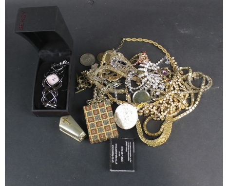 An assortment of vintage costume jewellery. Including a necklace and earring set, coins, locket, etc