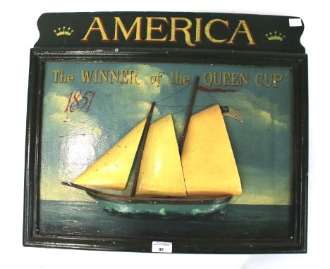 A vintage painted relief wooden wall hanging board. For the Winner of the Queen cup 'America' , depicting a boat at sea, 57cm