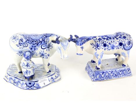 Two Delft ceramic models of cows. Both with signatures to the bases, height 16cm