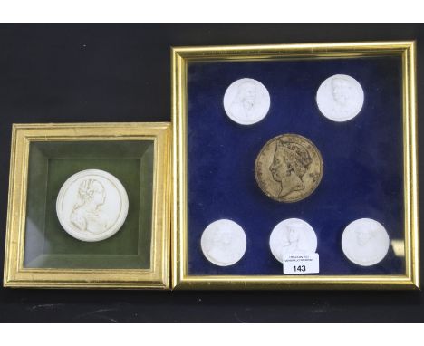 Two framed collections of plaster seals.,19th century and later. One with a group of portrait seals centred by a seal with a 