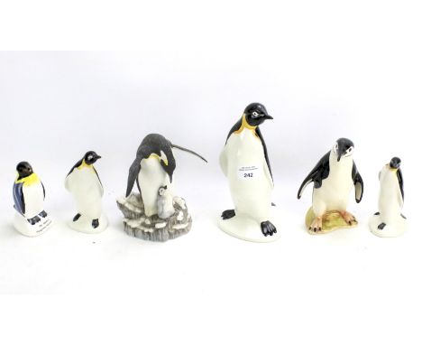 A collection of ceramic figures of penguins. Including three by Poole and one by Bovey Pottery. Maxium height 21.5cm.