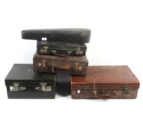 An assortment of vintage cases. Comprising an early 20th century brown leather lockable suitcase (with key); another smaller;