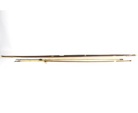 An ethnic wooden hunting long bow 123cm long. With two assorted metal tip arrows approx. 92cm