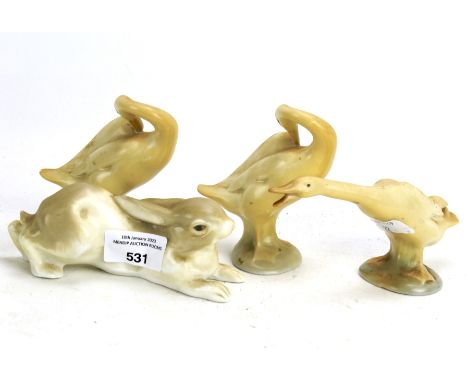 Four Lladro and ceramic figures. Comprising three birds and a rabbit