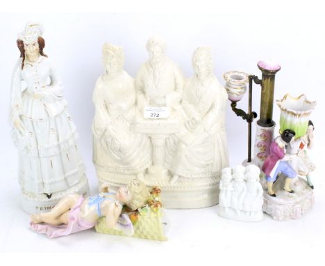 An assortment of ceramics. Including a putti wall bracket, Staffordshire style candlestick holder, etc