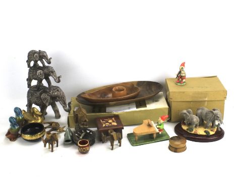 An assortment of figures of animals. Including ceramic and resin models of elephants, ducks, fish, etc