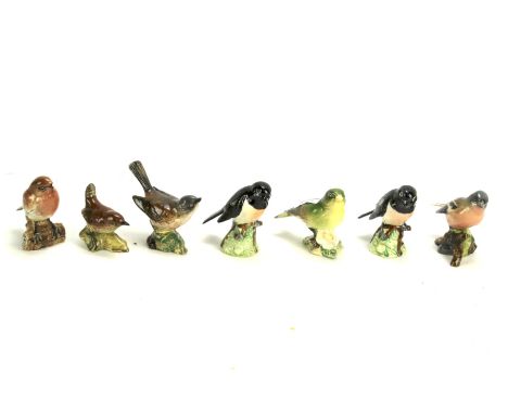 Seven Beswick ceramic models of birds. Including 'Chaffinch', 'Stonechat', 'Whitethroat', etc Max. height 8cm.