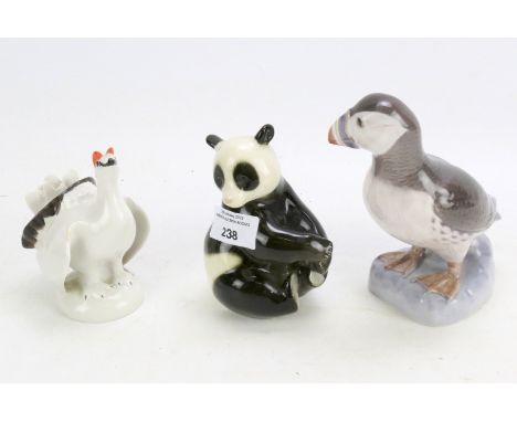Three ceramic models of animals. Comprising a Bing and Grondahl model of a puffin, no 2384, H16cm, a Lomonosov Russian porcel