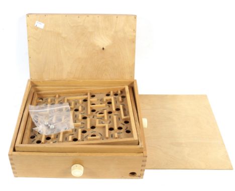 A vintage table top game. Featuring a marble tilt maze puzzle, L33cm x D30cm x H10cm