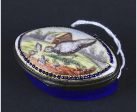 A 19th century snuff box. Of oval form, the lid decorated with a scene of birds feeding with a house in the background, mirro