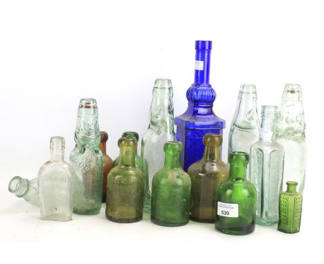 A collection of vintage glass bottles. Of assorted sizes and designs, some marked 'Rawlings'. Maxium height 30cm