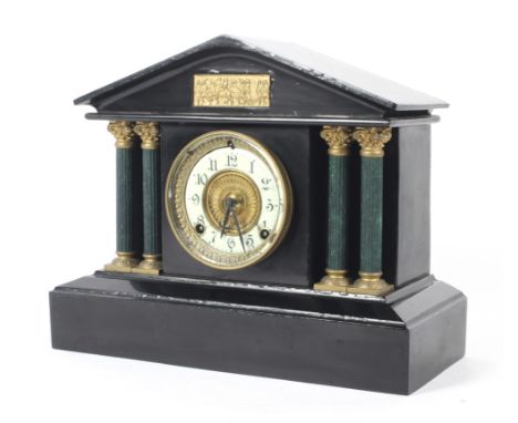 A late 19th century American cast metal mantel clock by the Ansonia clock company. The enamel dial with Arabic numerals denot