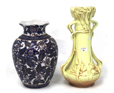 A contemporary Chinese ceramic vase and a large Art Nouveau style twin-handled vase. The Chinese vase decorated with blue fol