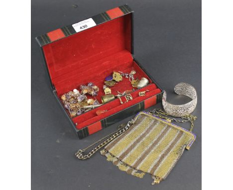 An assortment of costume jewellery. Including earrings, a bangle, mesh purse, etc