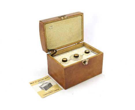 An Ever Ready Sky Casket portable radio. With the original instruction manual, length 23.5cm