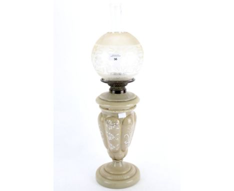 An early 20th century vaseline style glass oil lamp. Grey in colour, with white painted foliate decoration, glass shade and f