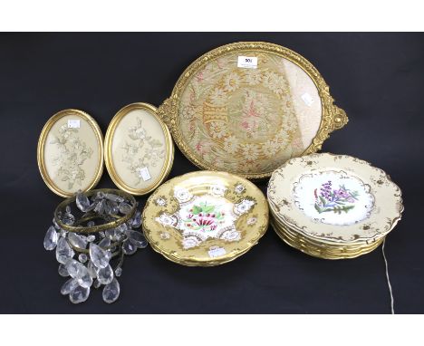 An assortment of collectables. Including ceramic plates, framed and glazed tapestries and a ceiling light