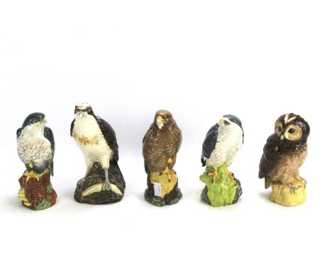 Five Royal Doulton 'Whyte &amp; Mackay Scotch Whisky' ceramic figures of birds. Comprising 'Osprey', 'Tawny Owl', 'Peregrine 