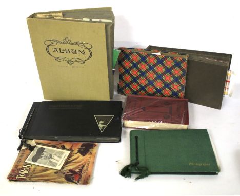 A collection of vintage postcards and photographs. Contained within five assorted albums, mostly depicting every day life, et