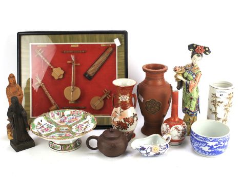 A collection of Chinese and Japanese items. Including wooden figures, Japanese Kutani vase of globular form with fluted neck,