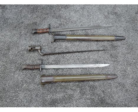 A US 1913 Pattern Bayonet by Winchester stamped 1917 with scabbard, blade length 43cm, overall length 56cm, a US 1913 Pattern