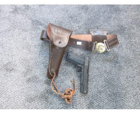 A leather US Army Holster &amp; Belt with ammunition pouch with a reproduction US Army 45 Pistol