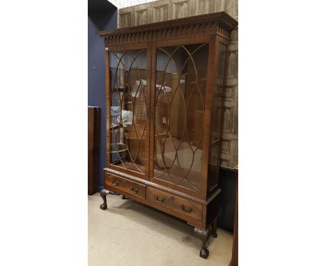 MAHOGANY DISPLAY CABINET OF CHIPPENDALE DESIGN the lofty cornice with moulded acorn drop frieze, adjustable shelving below en