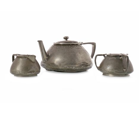 LIBERTY TUDRIC PEWTER TEA SERVICE IN THE MANNER OF JESSIE MARION KINGcomprising tea pot, sugar and milk, each stamped 'TUDRIC