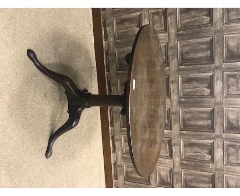 GEORGE III RED WALNUT CIRCULAR TIP-UP TRIPOD TEA TABLEwith bird cage action, on a turned tapering pillar, 79cm diameter