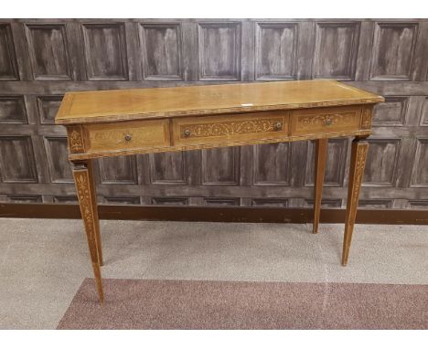KINGWOOD CONSOLE TABLEof Louis XVI design, the quarter veneered top with floral marquetry lozenge to centre, three frieze dra