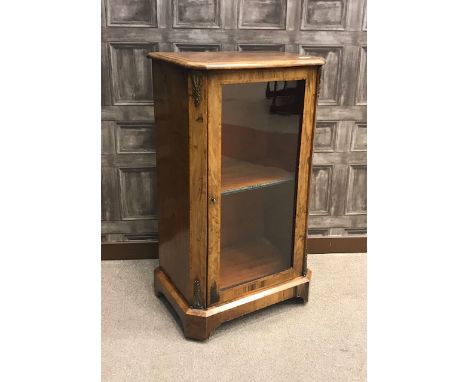 VICTORIAN WALNUT CROSSBANDED MUSIC CABINET with three interior shelves enclosed by a single glazed panel door, within canted 