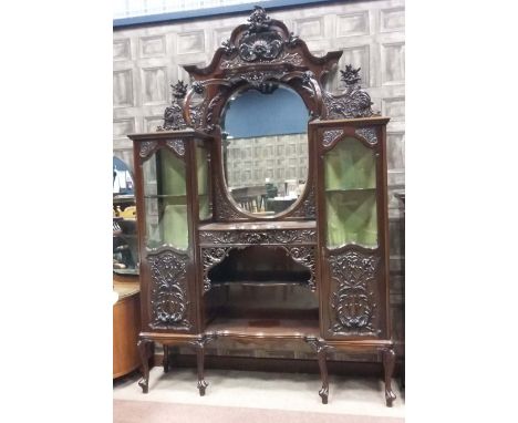 IMPRESSIVE VICTORIAN MAHOGANY DISPLAY CABINET OF ROCOCO DESIGN the lofty moulded cornice with carved and pierced cresting, op