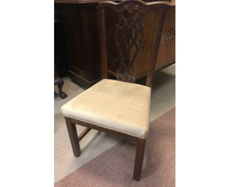 MAHOGANY VENEERED EXTENDING OBLONG TWIN PILLAR DINING TABLE of George III design, with two additional leaves, on tripod legs,