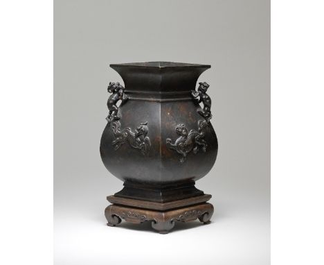 A BRONZE 'MYTHICAL BEAST' LOZENGE-SHAPED VASE, HULate Ming/early Qing DynastyFinely cast of archaistic hu form and lozenge se