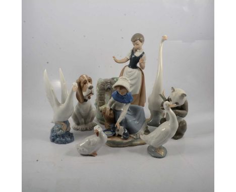 Nao Girl with Broken Jug No. 0223, 29.5cm; Milk For The Cat No. 0284, 20cm; Swan, 0107, 21cm; another swan, 29cm; Sad Hound D