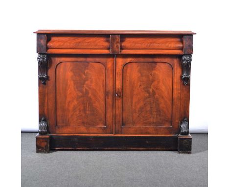 Victorian mahogany chiffonier, arched back with carved elements, above a rectangular top, two frieze drawers above arched pan