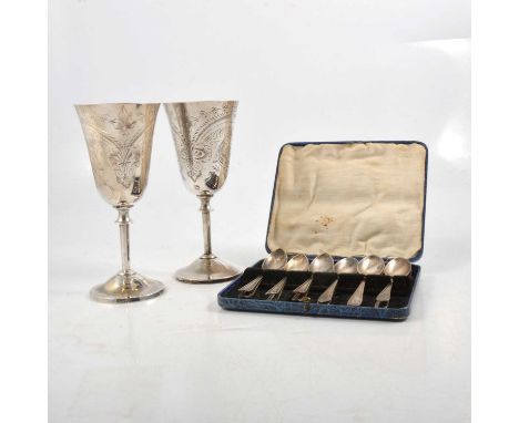 A silver sauce boat, maker's mark indistinct, London 1897, George III coin to base; a silver caddy spoon in the form of a lea