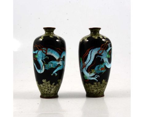 Pair of Japanese cloisonne vases, each decorated with a dragon on a black ground, cloud borders, stanped mark, 12cm.