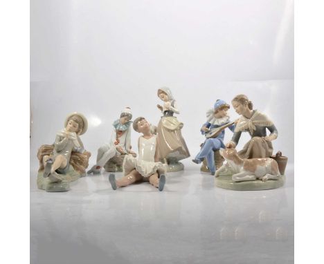 Three Lladro and Three Nao ceramic figurines, including Lladro 'Caressing a little calf', girl with turtle doves, boy reclini