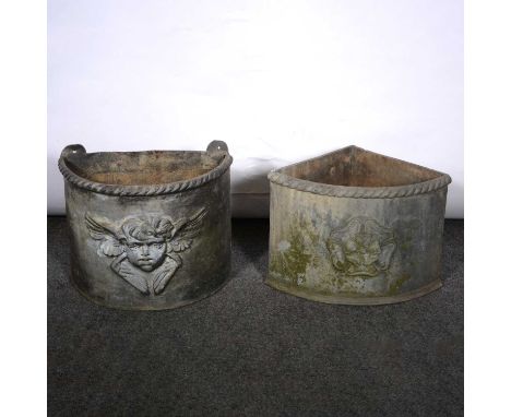 Georgian style lead demilune planter, cast with a cherub mask, width 35cm, depth 20cm, height 27cm; and a quadrant planter, w