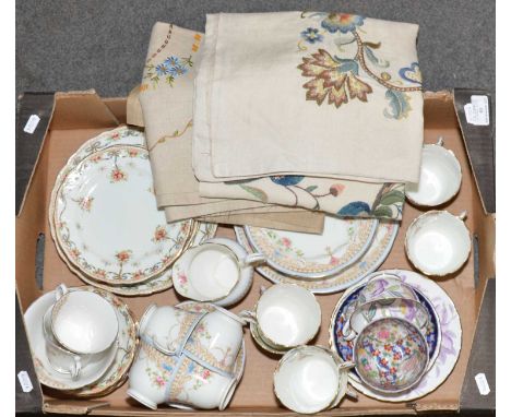 Two vintage floral design teasets, Queens China and Heathcote in the "Buxton" pattern, embroidered antmacassars.