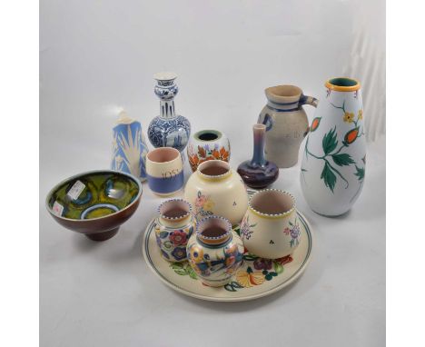A Poole Pottery charger, floral and bird decoration, 31.5cm; four vases of similar design; a Delphis pedestal bowl, green and