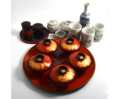 Two contemporary Japanese turned wood storage boxes, diameter 34cm and 24cm; red and black lacquered six-piece ice bowl set; 