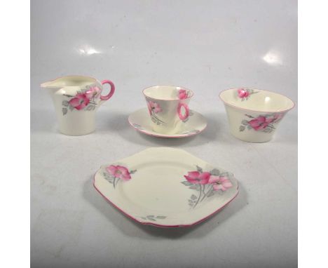 Shelley bone china part tea service, Art Deco shape with pink and grey rose pattern, comprising five trios, an additional sau