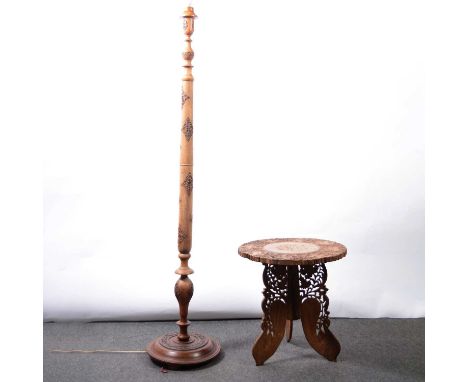 African carved hardwood standard lamp, height 151cm; and an African hardwood occasional table.