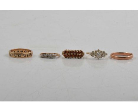 Five gold rings, a rose gold 3mm wide wedding band, Birmingham 1925, ring size R, 2.1g, a garnet half hoop dress ring, size P