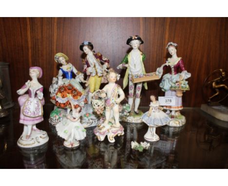 A COLLECTION OF CONTINENTAL CERAMIC FIGURES, TO INCLUDE A FIGURE GROUP OF A MAN AND WOMAN WITH ANIMALS, ALL WITH LOSSES (7)